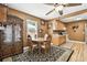 Charming dining area with a wooden table, chairs, and a china cabinet adjacent to the kitchen at 4725 3Rd S Ave, St Petersburg, FL 33711