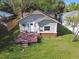 Charming home featuring a cozy front porch and a well-manicured lawn at 4725 3Rd S Ave, St Petersburg, FL 33711