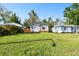 A charming home featuring a well-kept lawn and a quaint porch at 4725 3Rd S Ave, St Petersburg, FL 33711