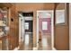 Hallway with view of two bedrooms with neutral paint and hardwood flooring at 4725 3Rd S Ave, St Petersburg, FL 33711