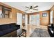 Spacious living room with wood floors, ceiling fan, and an inviting ambiance for relaxation at 4725 3Rd S Ave, St Petersburg, FL 33711
