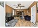Comfortable living room with ceiling fan, wood floors, and open layout connecting to the kitchen at 4725 3Rd S Ave, St Petersburg, FL 33711