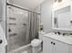 Bathroom with marble tile, a marble vanity, and a marble shower with black trim at 4816 N Highland Ave, Tampa, FL 33603