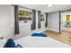 Bedroom with gray walls, hardwood floors, and two windows that let in natural light at 4816 N Highland Ave, Tampa, FL 33603
