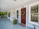 Welcoming front entrance with a decorative wreath, a 'Home' mat, and updated trim at 4816 N Highland Ave, Tampa, FL 33603