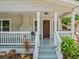 Inviting front porch with decorative wreath, string lights, and a cozy entryway at 4816 N Highland Ave, Tampa, FL 33603