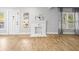 Bright, open living room with wood-look floors and a white decorative fireplace at 4816 N Highland Ave, Tampa, FL 33603