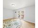 An empty room with natural light and hardwood floors provides the perfect blank canvas for interior design at 4816 N Highland Ave, Tampa, FL 33603