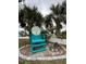 Private Beach Club for members, featuring an inviting chair surrounded by palm trees and lush landscaping at 4939 Floramar Ter # 810, New Port Richey, FL 34652