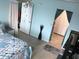 Bright bedroom featuring a ceiling fan, coastal themed bedding, and light blue walls at 4939 Floramar Ter # 810, New Port Richey, FL 34652