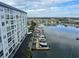 Exterior view from condo showing marina, ocean, docks, boats and coastal community at 4939 Floramar Ter # 810, New Port Richey, FL 34652