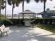 A convenient outdoor grilling area with a stainless steel grill and seating at 4939 Floramar Ter # 810, New Port Richey, FL 34652