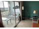 Comfortable living area adjacent to a balcony, with stylish decor, and sliding glass door at 4939 Floramar Ter # 810, New Port Richey, FL 34652