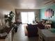 Spacious living room with tile floors and sliding glass doors to lanai at 4939 Floramar Ter # 810, New Port Richey, FL 34652