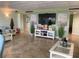 Inviting lounge area with stylish furnishings, tile flooring, and festive holiday decorations at 4939 Floramar Ter # 810, New Port Richey, FL 34652