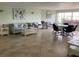 Bright and spacious lounge with tile flooring, comfortable seating, and inviting decor at 4939 Floramar Ter # 810, New Port Richey, FL 34652