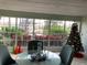 Comfortable sitting area with Christmas tree and large windows offering water views at 4939 Floramar Ter # 810, New Port Richey, FL 34652