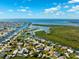 Aerial view of the waterfront neighborhood featuring scenic canals, waterfront homes and ocean access at 5500 Leahy Ln, New Port Richey, FL 34652