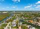 An overhead perspective of homes nestled alongside canals, featuring easy access to waterways and nearby amenities at 5500 Leahy Ln, New Port Richey, FL 34652