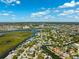 Aerial view of the waterfront neighborhood with scenic canals and neighborhood close to the ocean at 5500 Leahy Ln, New Port Richey, FL 34652