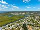 A scenic aerial view reveals a charming neighborhood near lush mangroves and winding waterways, close to urban amenities at 5500 Leahy Ln, New Port Richey, FL 34652