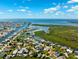 Aerial view of the waterfront neighborhood featuring scenic canals, waterfront homes and ocean access at 5500 Leahy Ln, New Port Richey, FL 34652