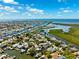 Aerial view of the waterfront neighborhood featuring scenic canals, waterfront homes and ocean access at 5500 Leahy Ln, New Port Richey, FL 34652