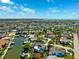 This aerial view showcases waterfront homes with boat docks along winding canals, offering a picturesque coastal lifestyle at 5500 Leahy Ln, New Port Richey, FL 34652