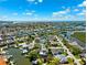 Aerial view of the coastal neighborhood with waterfront homes and convenient boating access at 5500 Leahy Ln, New Port Richey, FL 34652
