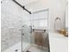Modern bathroom features a glass shower and updated fixtures at 5500 Leahy Ln, New Port Richey, FL 34652