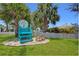Charming private beach club entrance with a blue lifeguard chair, promising exclusive relaxation and coastal access at 5500 Leahy Ln, New Port Richey, FL 34652