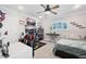 Vibrant bedroom with contemporary decor, a dedicated gaming station, and a comfortable bed at 5500 Leahy Ln, New Port Richey, FL 34652