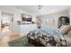 Relaxing bedroom with television, shutters, and hardwood flooring throughout at 5500 Leahy Ln, New Port Richey, FL 34652