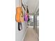 Hallway featuring a guitar wall hanger system, carpeted floors, and a bathroom at 5500 Leahy Ln, New Port Richey, FL 34652