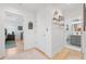 Bright hallway area with hardwood floors and decorated with Gathering decor at 5500 Leahy Ln, New Port Richey, FL 34652