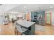 Kitchen and dining area with stainless steel appliances, a large island, and abundant natural light at 5500 Leahy Ln, New Port Richey, FL 34652