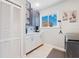 Bright laundry room featuring modern cabinetry, quartz countertops, and an adjacent closet for ample storage solutions at 5500 Leahy Ln, New Port Richey, FL 34652