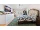 Sunlit bedroom with french doors, closet, dresser, and beach view TV at 5500 Leahy Ln, New Port Richey, FL 34652