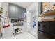 Pantry featuring ample storage solutions, including shelves and drawers, plus a utility cart for extra organization at 5500 Leahy Ln, New Port Richey, FL 34652