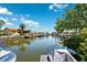 Beautiful waterfront view with boat docks and lush landscaping at 5500 Leahy Ln, New Port Richey, FL 34652