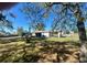Expansive backyard featuring a well and covered area, perfect for outdoor activities at 6012 Landover Blvd, Spring Hill, FL 34609