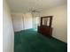 Bedroom with mirrored dresser, ceiling fan and closet at 6012 Landover Blvd, Spring Hill, FL 34609
