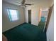 Standard bedroom features a ceiling fan, a window for natural light, and a closet at 6012 Landover Blvd, Spring Hill, FL 34609