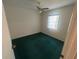 A basic bedroom includes a ceiling fan for climate control and a window for natural light at 6012 Landover Blvd, Spring Hill, FL 34609