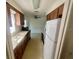 Traditional kitchen with ample cabinet space and adjacent to a living area at 6012 Landover Blvd, Spring Hill, FL 34609