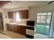 Traditional kitchen featuring plenty of counter space, cabinets, and access to a screened patio at 6012 Landover Blvd, Spring Hill, FL 34609