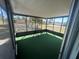 Bright screened patio with turf flooring, perfect for enjoying the outdoors at 6012 Landover Blvd, Spring Hill, FL 34609