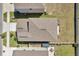 Aerial view of the home showcasing the roof, landscaping, and surrounding neighborhood with well maintained yards at 6068 Apple Snail Ave, New Port Richey, FL 34653