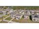 An aerial view of the neighborhood showing homes with private backyards and community landscaping at 6068 Apple Snail Ave, New Port Richey, FL 34653