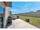 Private backyard with patio, outdoor seating, grill, and fire pit at 6068 Apple Snail Ave, New Port Richey, FL 34653